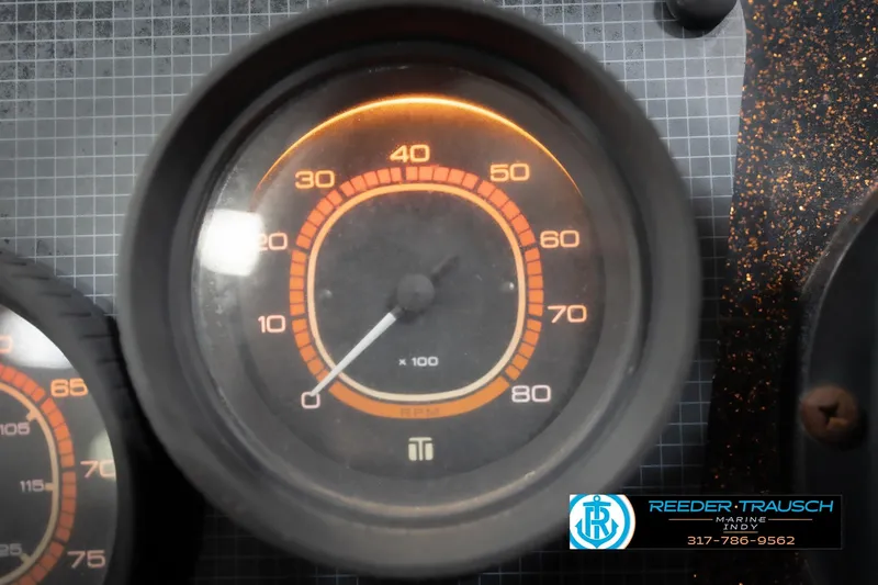 Slide: The Image of RPM gauge of 1986 ProCraft 1775 Bass boat dashboard, Reeder Trausch Marine logo visible. - 38