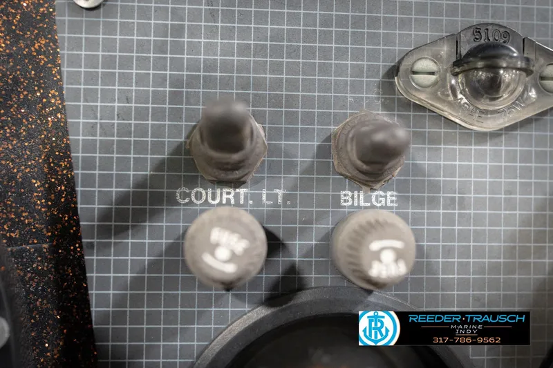 Slide: The Image of Control panel of a 1986 ProCraft 1775 Bass boat with switches and labels. - 39