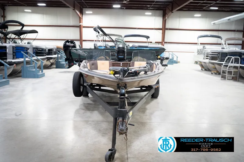Slide: The Image of 1986 ProCraft 1775 Bass boat on trailer in indoor showroom. - 4