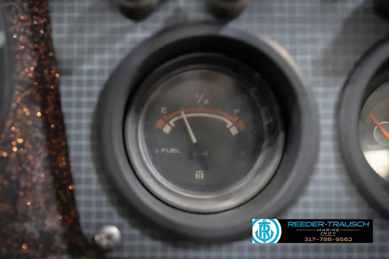 Slide: The Image of Fuel gauge of 1986 ProCraft 1775 Bass boat, showing near empty. - 42