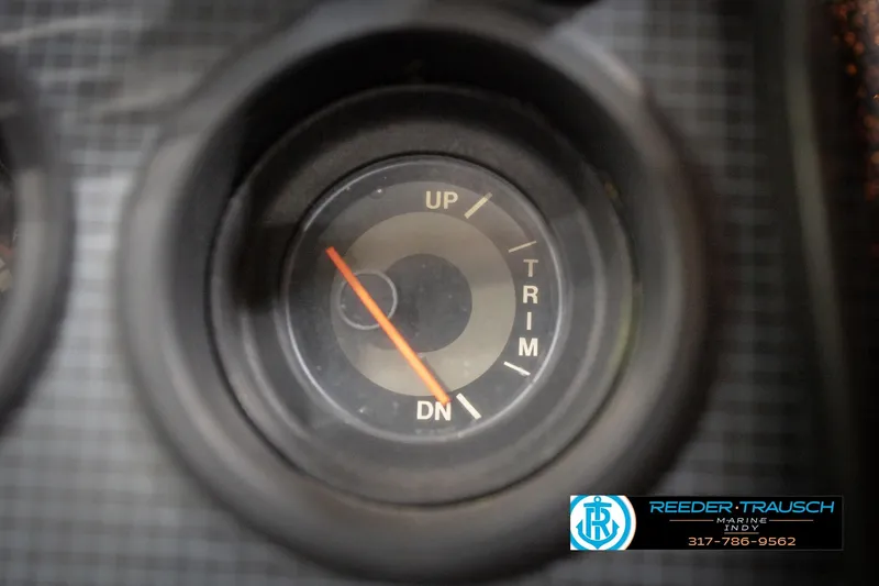 Slide: The Image of Close-up of a 1986 ProCraft 1775 Bass boat trim gauge, showing "UP" and "DN" indicators. - 43