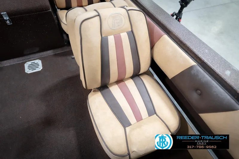 Slide: The Image of 1986 ProCraft 1775 Bass boat seat with striped upholstery, Reeder-Trausch Marine logo visible. - 48