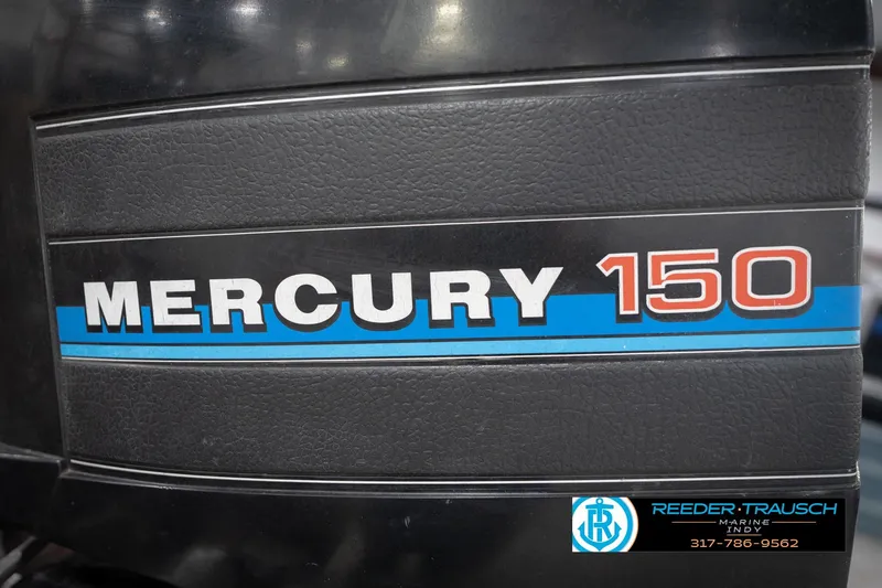 Slide: The Image of Mercury 150 outboard motor on 1986 ProCraft 1775 Bass boat, Reeder-Trausch Marine logo. - 51