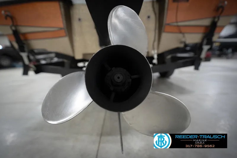 Slide: The Image of Propeller of 1986 ProCraft 1775 Bass boat in a showroom setting. - 53