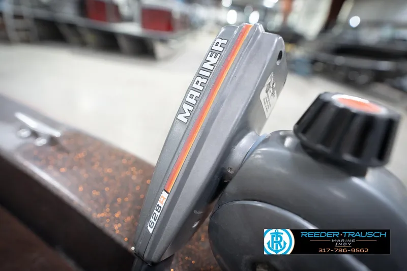 Slide: The Image of 1986 ProCraft 1775 Bass boat with Mariner engine detail, Reeder-Trausch Marine logo visible. - 55