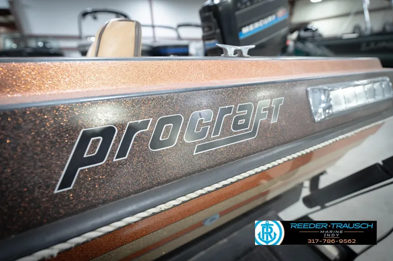 Slide: The Image of 1986 ProCraft 1775 Bass boat with metallic finish, displayed at Reeder-Trausch Marine. - 57