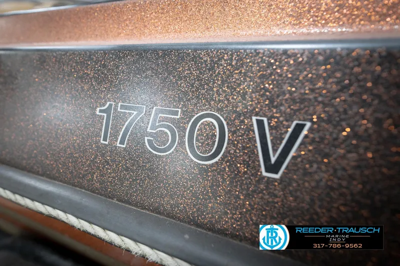 Slide: The Image of 1986 ProCraft 1775 Bass boat with metallic finish, featuring "1750 V" text. - 58