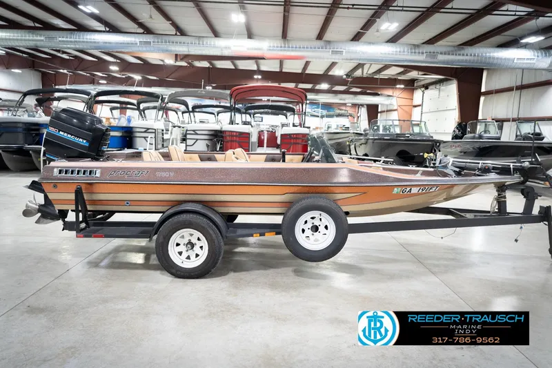 Slide: The Image of 1986 ProCraft 1775 Bass boat on trailer in indoor showroom. - 6