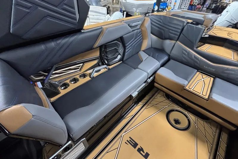 Slide: The Image of Luxurious interior of 2026 Tigé Ultré 25ZX boat with stylish seating and cup holders. - 8