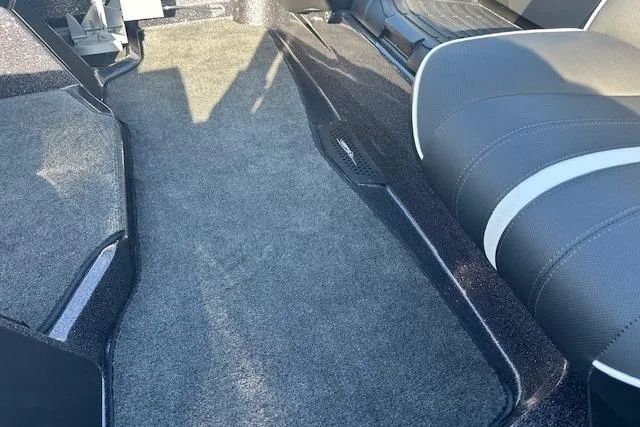 Slide: The Image of Interior of 2026 Skeeter ZXE21 boat with carpeted flooring and seating. - 4