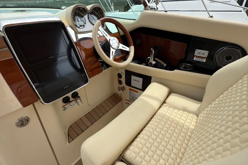 Slide: The Image of 2022 Chris-Craft Launch 35 GT cockpit with luxurious seating and modern dashboard controls. - 12