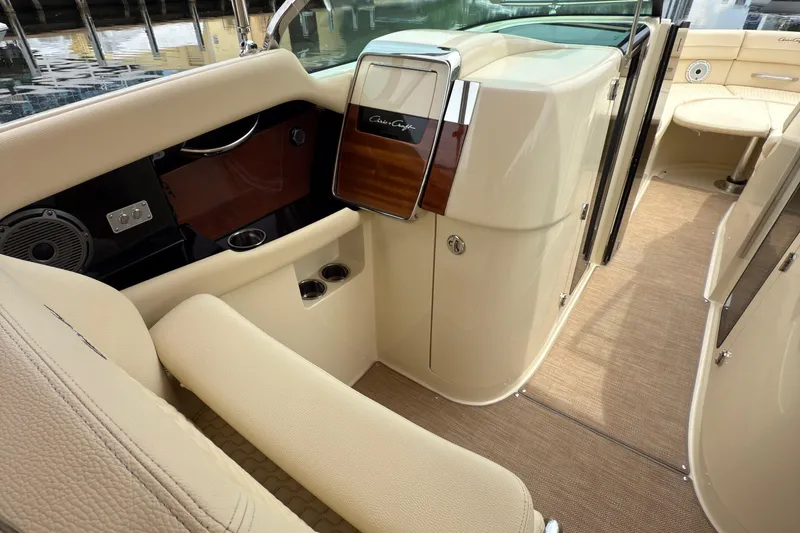 Slide: The Image of 2022 Chris-Craft Launch 35 GT interior with beige seating and elegant wood accents. - 16