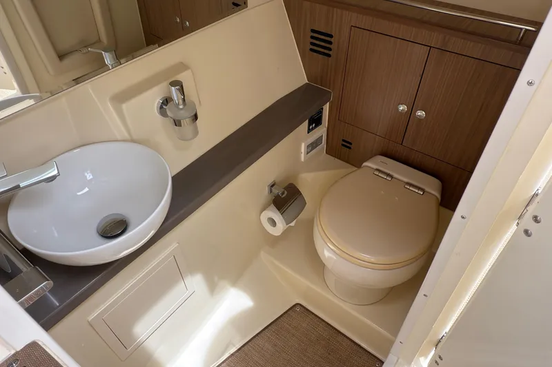 Slide: The Image of 2022 Chris-Craft Launch 35 GT bathroom with modern sink and toilet design. - 17