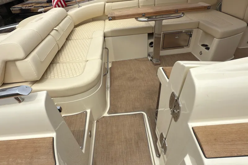 Slide: The Image of Luxurious interior of 2022 Chris-Craft Launch 35 GT with beige seating and wooden accents. - 19