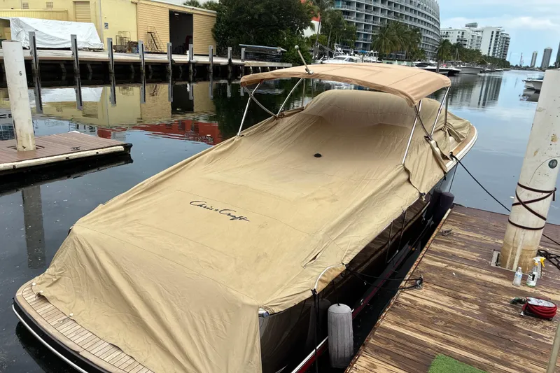 Slide: The Image of 2022 Chris-Craft Launch 35 GT boat covered at a dockside marina. - 29