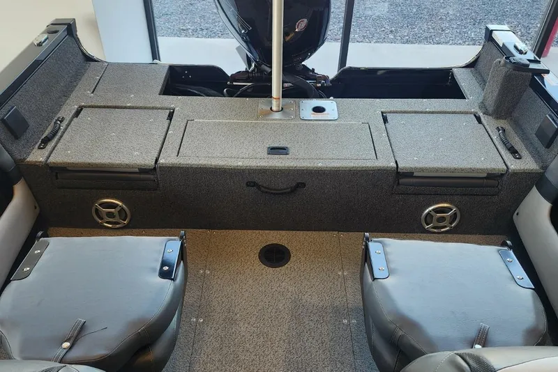 Slide: The Image of Interior of a 2023 Lowe boat featuring seating and storage compartments. - 15