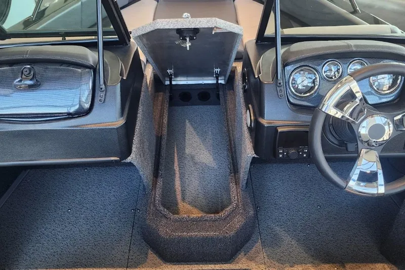 Slide: The Image of 2023 Lowe boat interior with steering wheel, dashboard, and open storage compartment. - 18