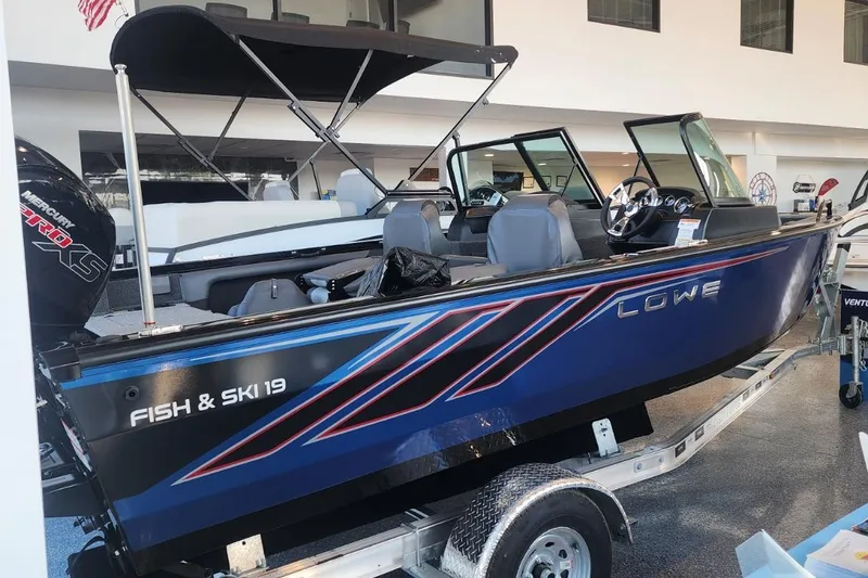 Slide: The Image of 2023 Lowe Fish & Ski 19 boat with Mercury Pro XS engine on display. - 5