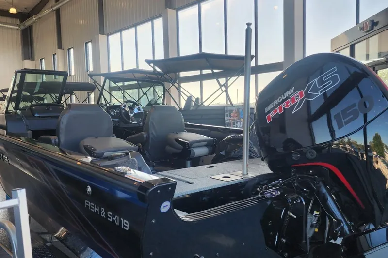 Slide: The Image of 2023 Lowe Fish & Ski 19 boat with Mercury Pro XS 150 engine in showroom. - 8