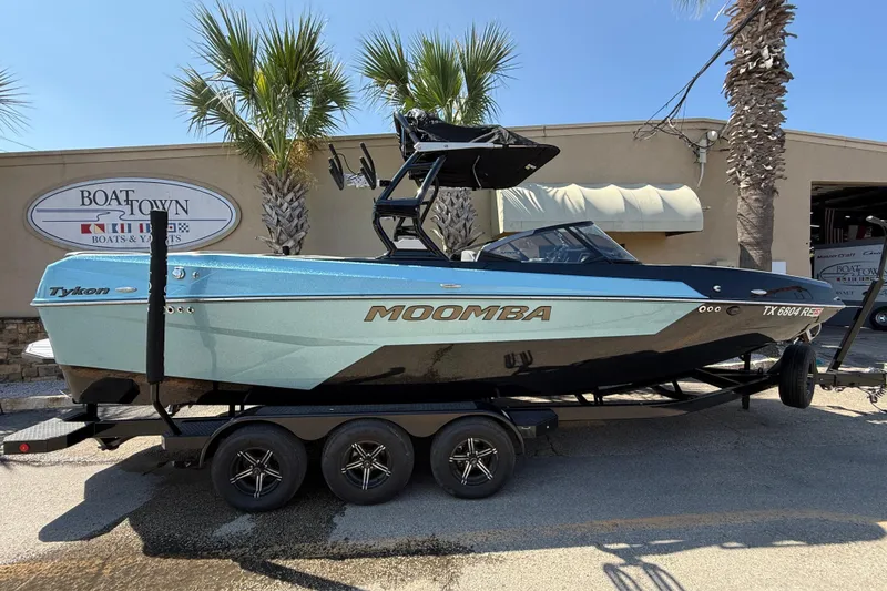 The Image of 2024 Moomba Tykon boat on trailer, displayed at Boat Town dealership. - 1
