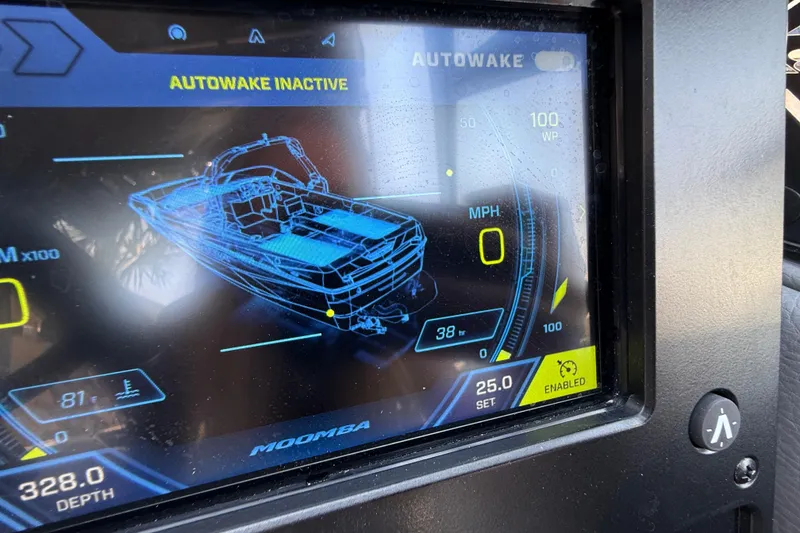Slide: The Image of 2024 Moomba Tykon dashboard display showing Autowake inactive and boat metrics. - 12