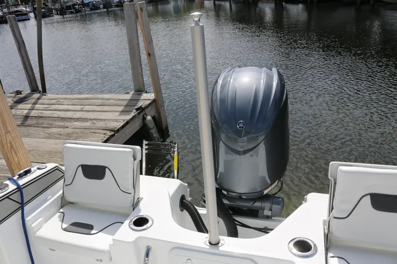 Slide: The Image of 2026 Wellcraft 202 Fisherman boat with outboard motor at dockside. - 26