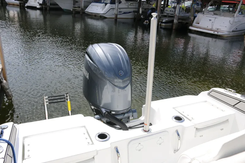Slide: The Image of 2026 Wellcraft 202 Fisherman boat with Yamaha outboard motor docked at marina. - 27