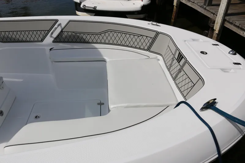 Slide: The Image of 2026 Wellcraft 202 Fisherman boat interior with cushioned seating and storage compartments. - 4