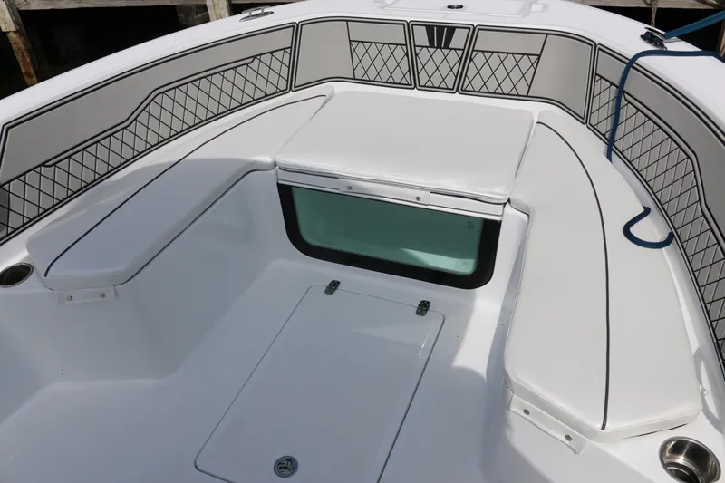 Slide: The Image of 2026 Wellcraft 202 Fisherman boat interior with cushioned seating and storage compartments. - 5