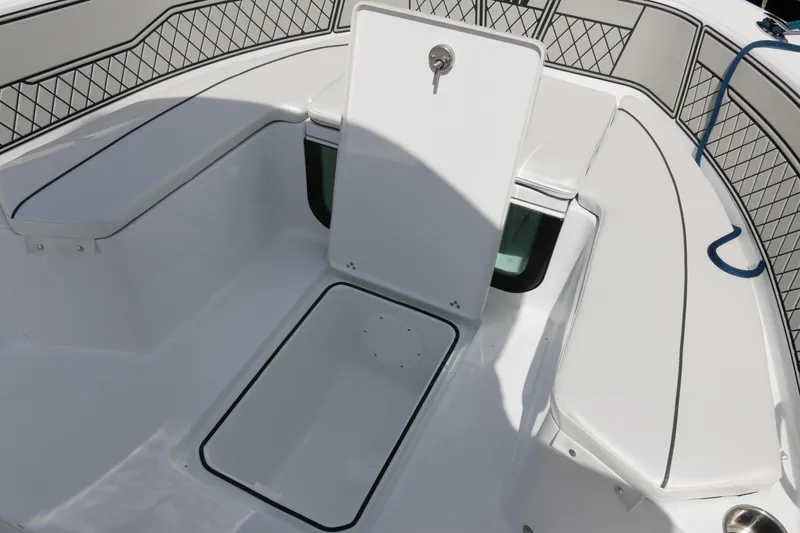 Slide: The Image of 2026 Wellcraft 202 Fisherman boat interior with storage compartments and seating. - 9