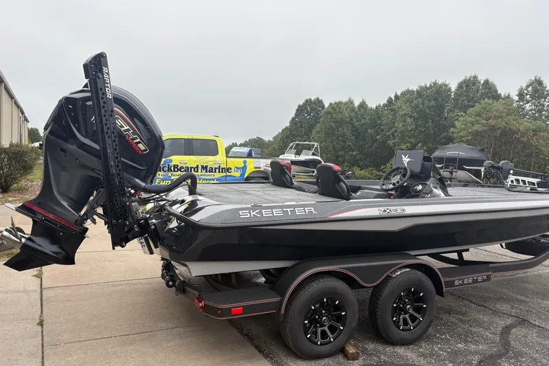 Slide: The Image of 2026 Skeeter ZXE21 boat with powerful outboard motor on a trailer. - 2