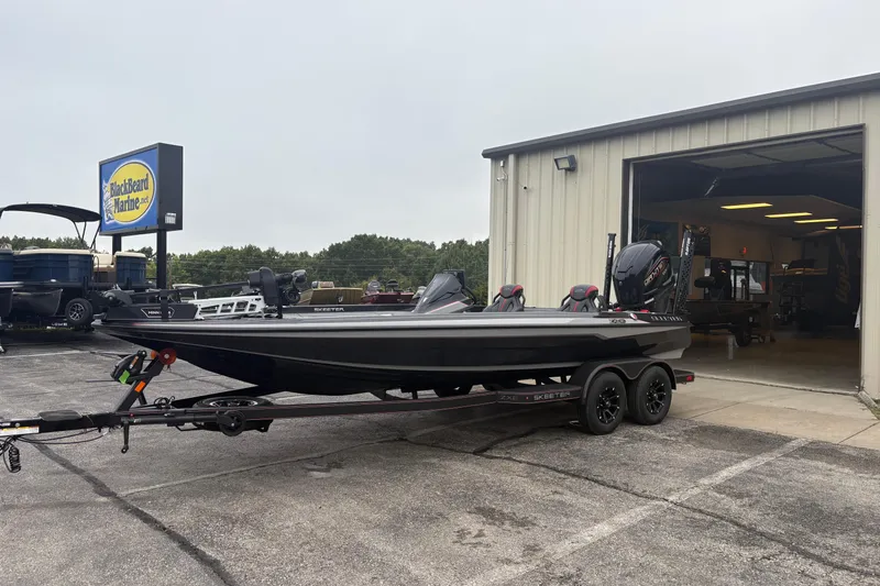 Slide: The Image of 2026 Skeeter ZXE21 boat on trailer outside BlackBeard Marine dealership. - 4