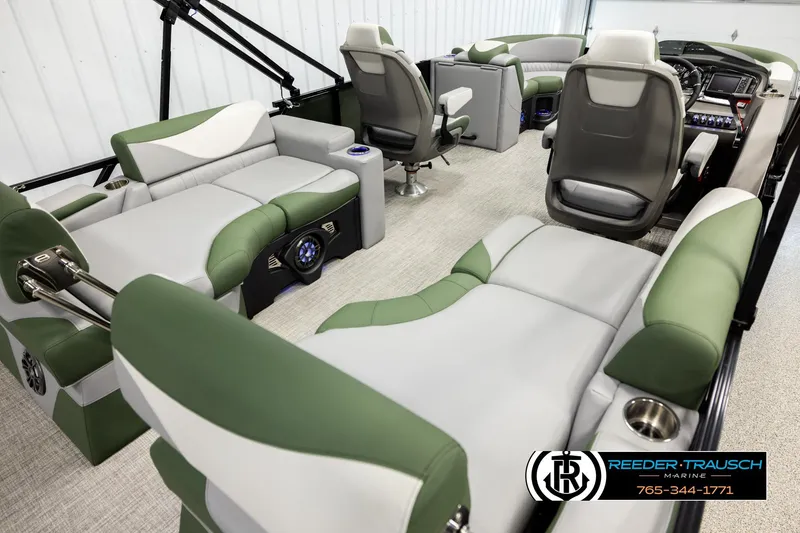 Slide: The Image of Luxurious interior of 2026 Avalon LSZ QLS pontoon boat with green and gray seating. - 11