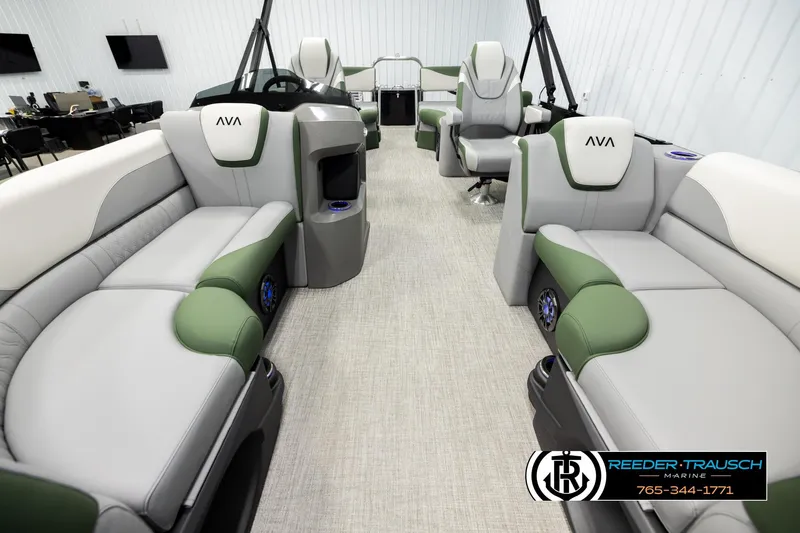 Slide: The Image of 2026 Avalon LSZ QLS pontoon boat interior with green and gray seating, modern design. - 12