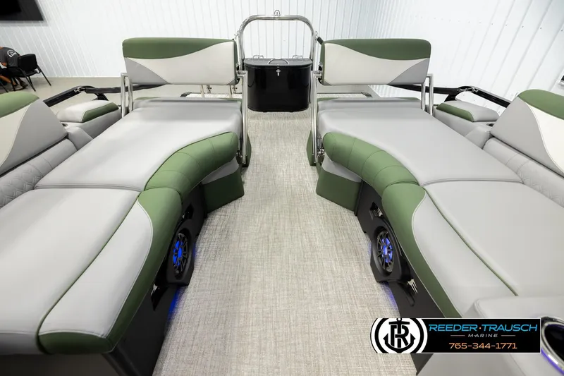 Slide: The Image of Luxurious interior of 2026 Avalon LSZ QLS pontoon boat with green and gray seating. - 15