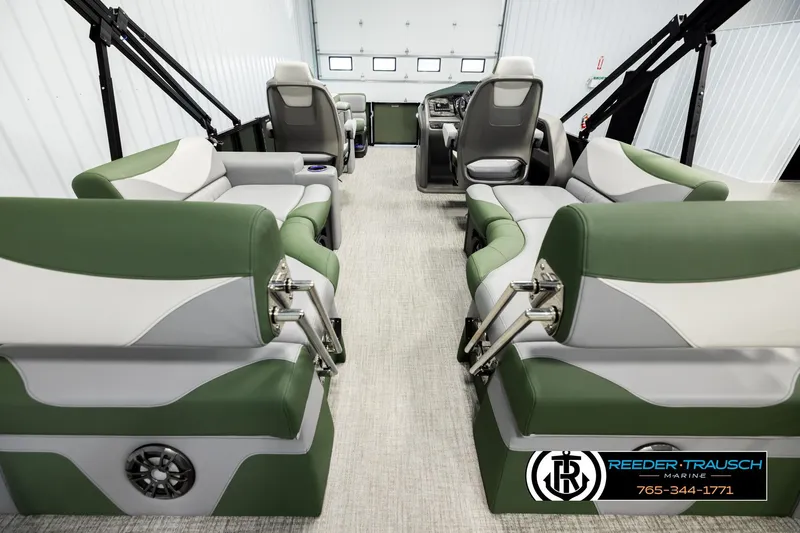 Slide: The Image of Interior of 2026 Avalon LSZ QLS pontoon boat with green and white seating. - 17