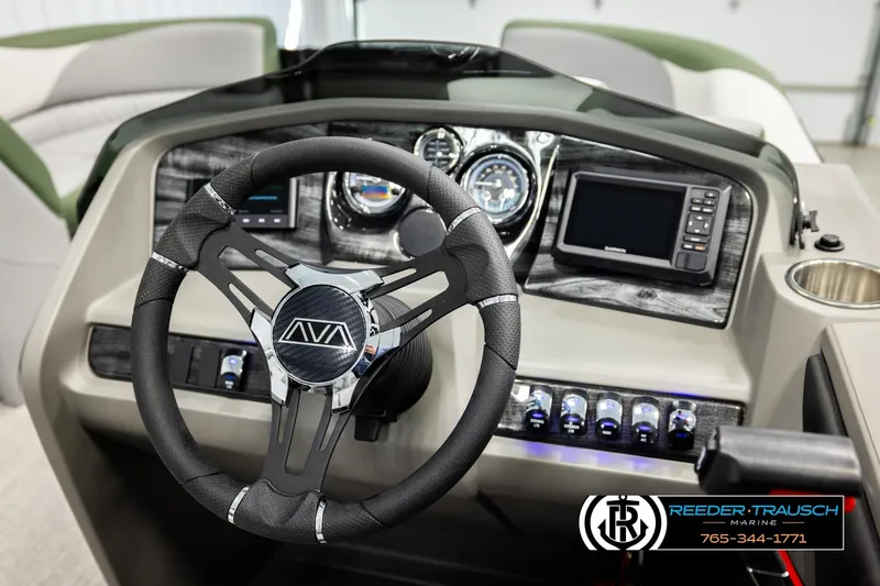 Slide: The Image of 2026 Avalon LSZ QLS boat dashboard with steering wheel, gauges, and Garmin display. - 25