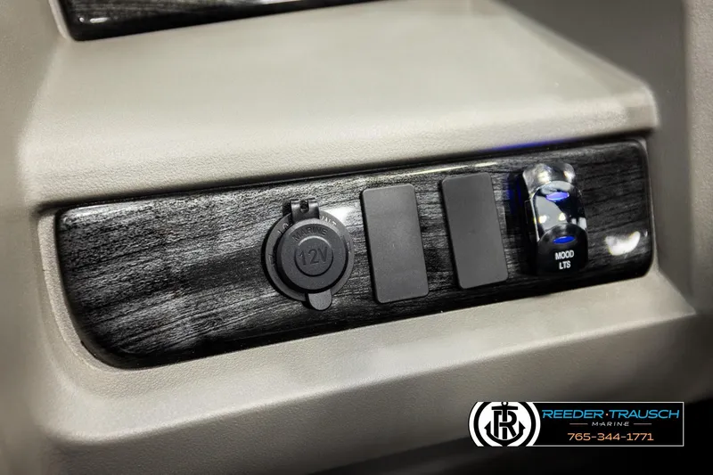 Slide: The Image of Control panel of 2026 Avalon LSZ QLS with 12V outlet and mood lighting switch. - 28