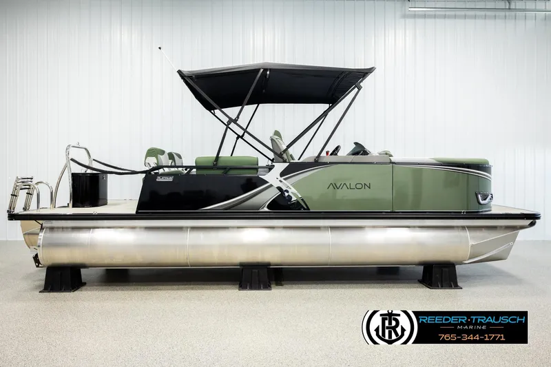 Slide: The Image of 2026 Avalon LSZ QLS pontoon boat with canopy in showroom, side view. - 4