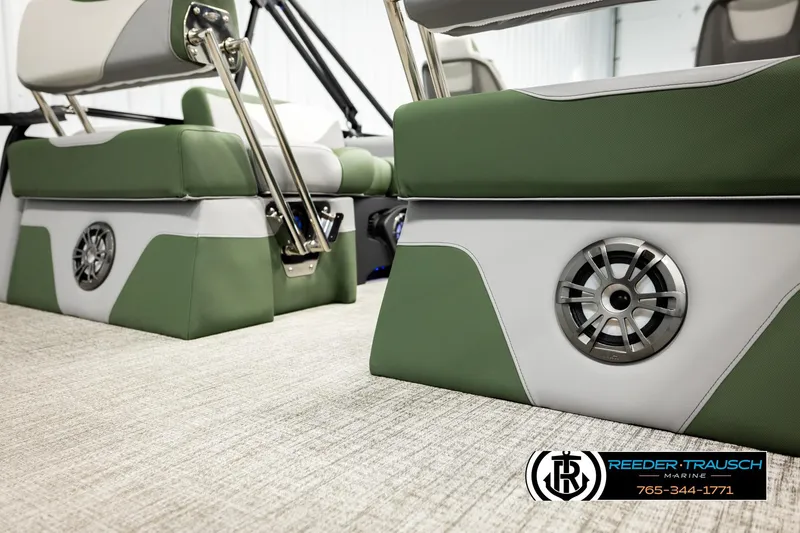 Slide: The Image of Interior of 2026 Avalon LSZ QLS boat with green and white seating and speaker system. - 42