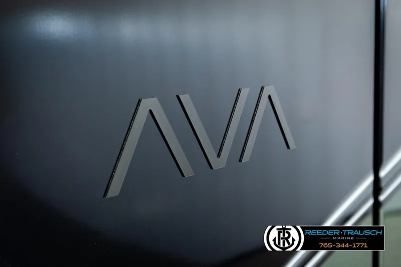 Slide: The Image of 2026 Avalon LSZ QLS logo on sleek black surface, Reeder-Trausch Marine branding visible. - 44