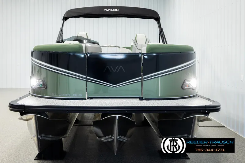 Slide: The Image of 2026 Avalon LSZ QLS pontoon boat in showroom, featuring sleek design and modern features. - 7