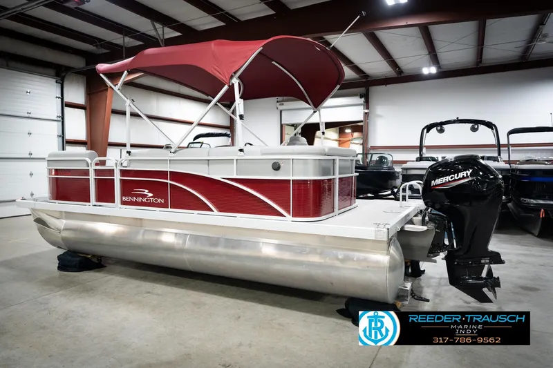 Slide: The Image of 2023 Bennington 20 SV pontoon boat with red canopy and Mercury outboard motor. - 10