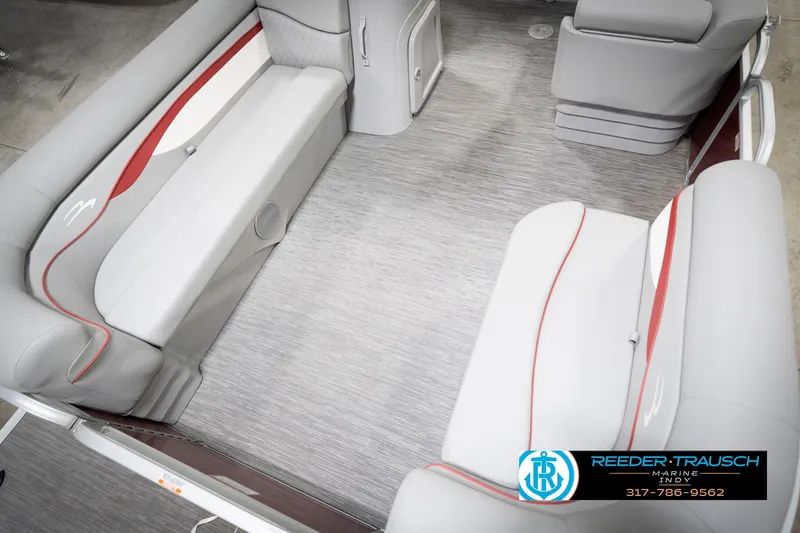 Slide: The Image of 2023 Bennington 20 SV boat interior with gray and red seating, spacious layout. - 12