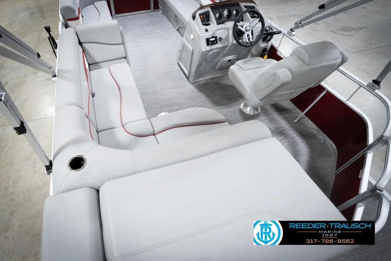 Slide: The Image of 2023 Bennington 20 SV pontoon boat interior with plush seating and modern helm. - 15