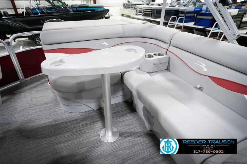 Slide: The Image of 2023 Bennington 20 SV pontoon boat interior with seating and table, showcased at Reeder-Trausch Marine. - 28