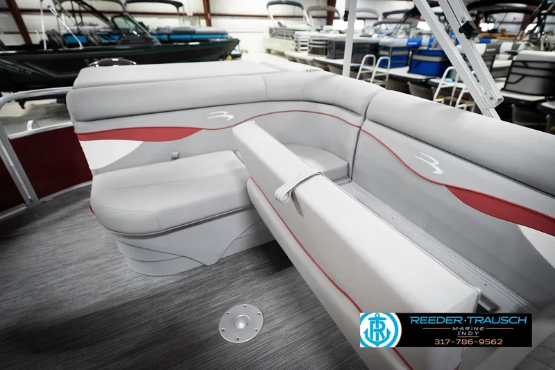 Slide: The Image of 2023 Bennington 20 SV pontoon boat interior with gray and red seating. - 31