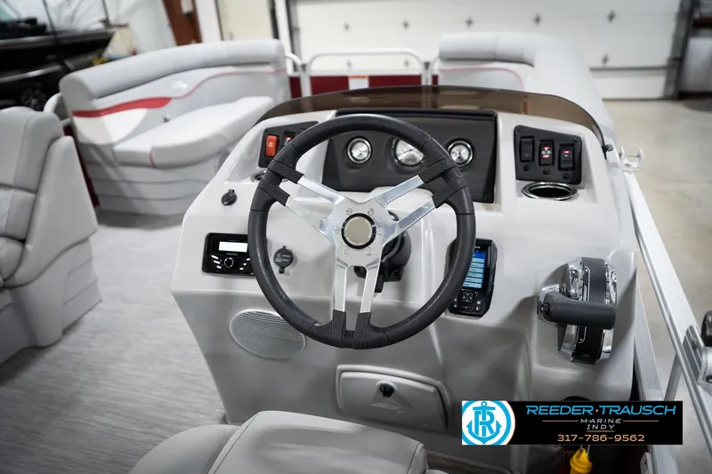 Slide: The Image of 2023 Bennington 20 SV boat interior with steering wheel and control panel. - 34