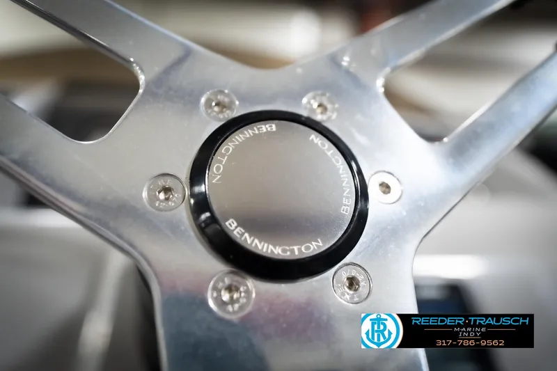 Slide: The Image of Close-up of 2023 Bennington 20 SV steering wheel with logo and screws. - 36