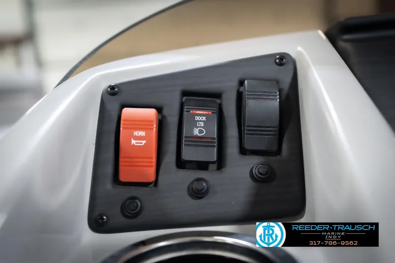 Slide: The Image of Control panel of 2023 Bennington 20 SV boat with horn and dock lights switches. - 38
